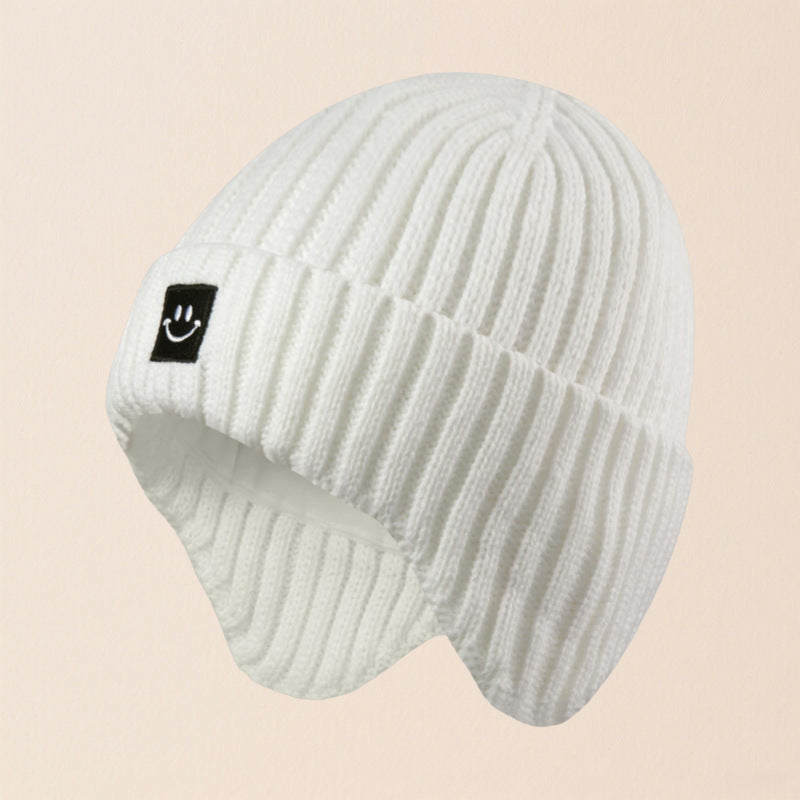 Gorro cálido de esquí con orejeras y cara sonriente para niños