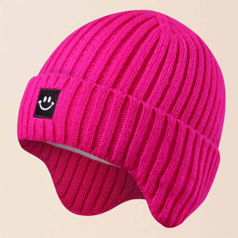 Gorro cálido de esquí con orejeras y cara sonriente para niños